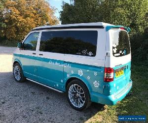 VW T5 camper van with pop top, sleeps 4 with 5 belted seats.