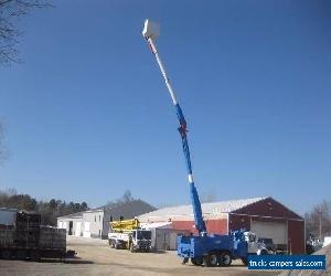 2002 INTERNATIONAL 4900 DT466 5 SPEED AUTOMATIC WITH 60 REACH BUCKET/BOOM,