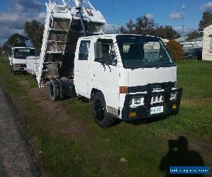 isuzu tipper  diesel  dual cab truck comes with reg 